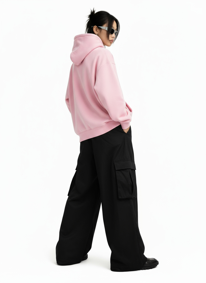 Virtual model wearing a black t-shirt and light-wash jeans, standing with hands in pockets against a clean white background. This image highlights the full outfit for e-commerce.